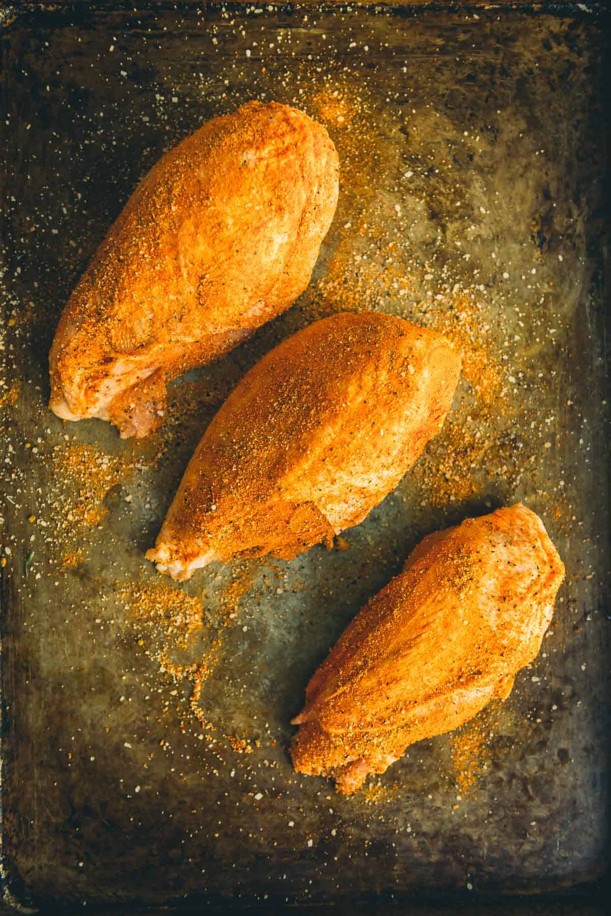 Chicken breats rubbed with spices.