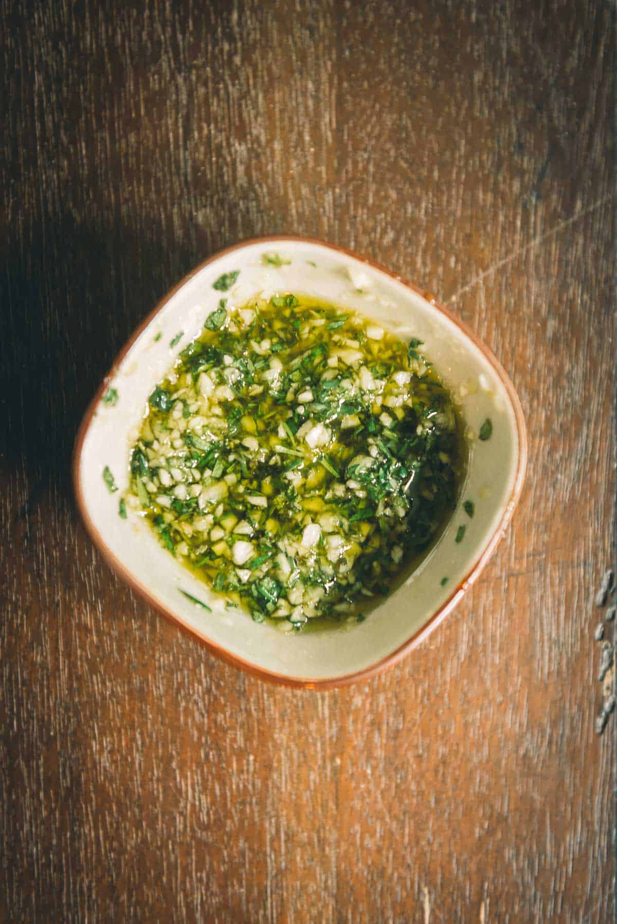 Garlic and herb paste in a bowl.