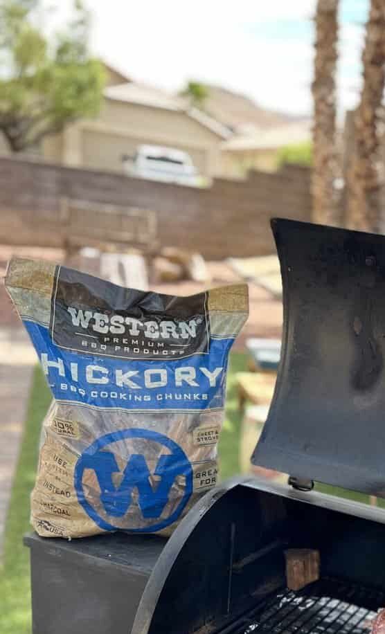 Western wood hickory chunks on a grill.