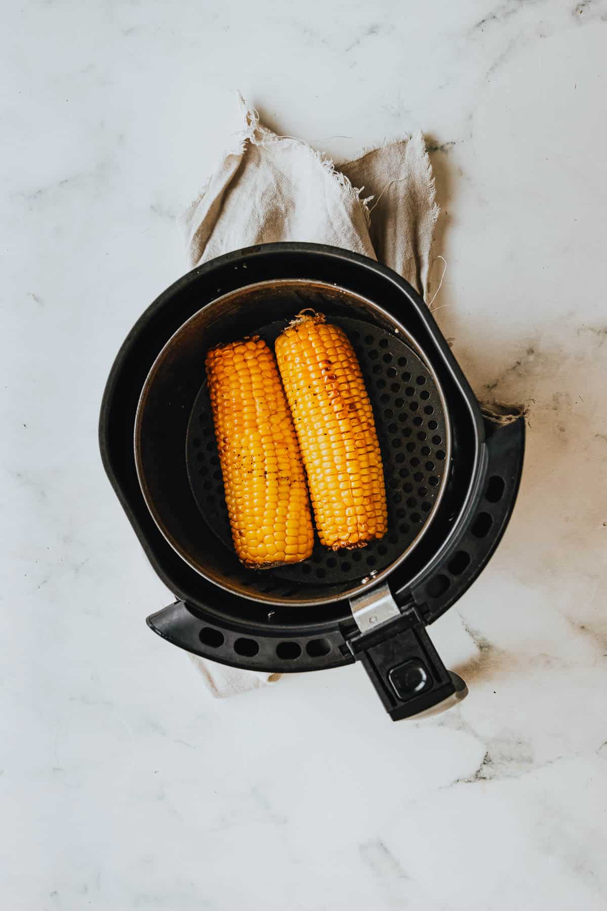 Corn on the cob in an air fryer.