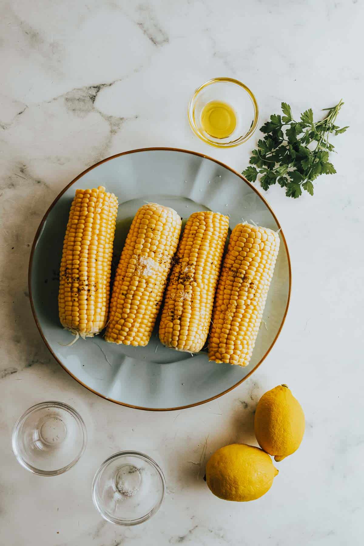 Corn on the cob with lemon and herbs.