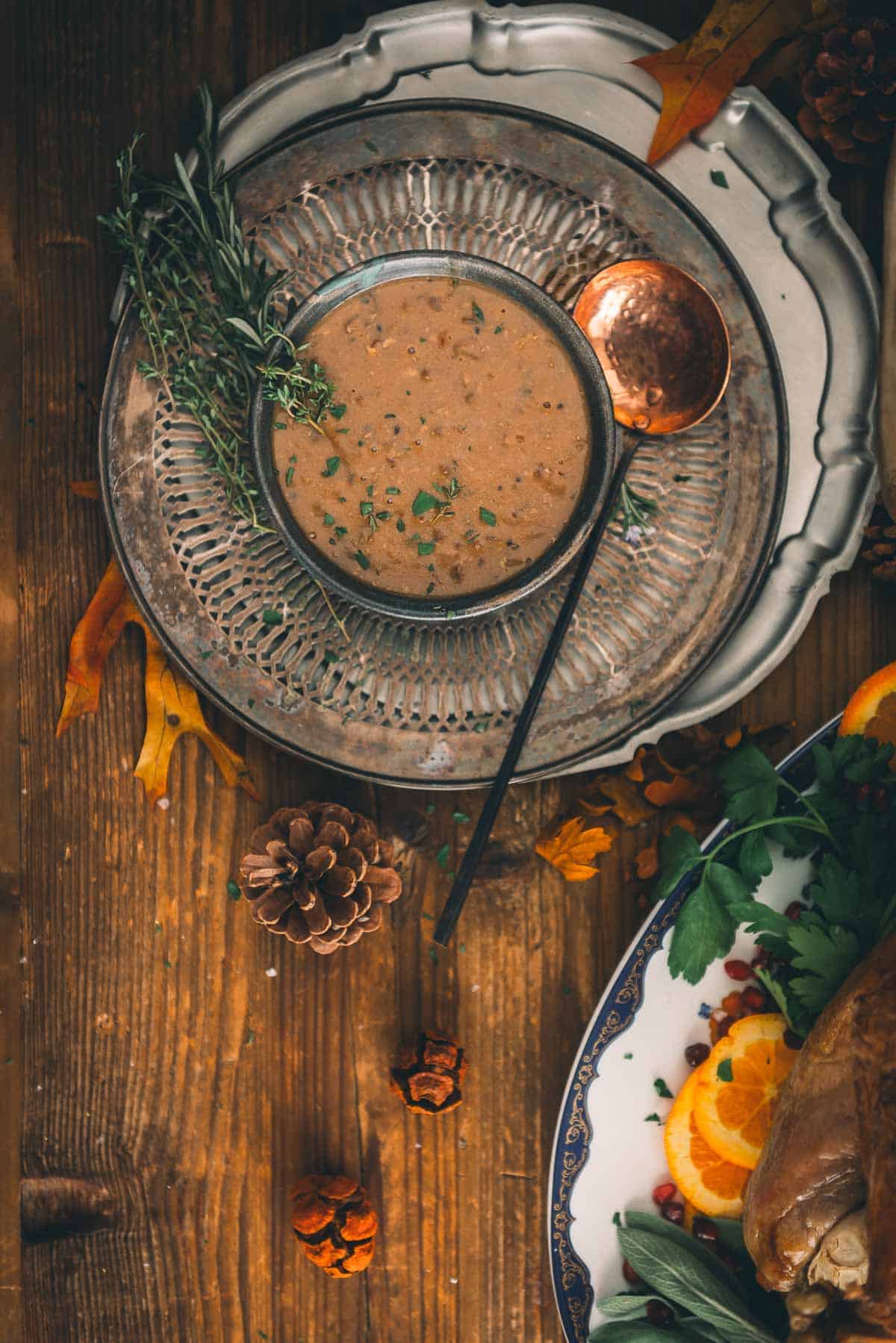 Giblet gravy in a bowl on a wooden table.