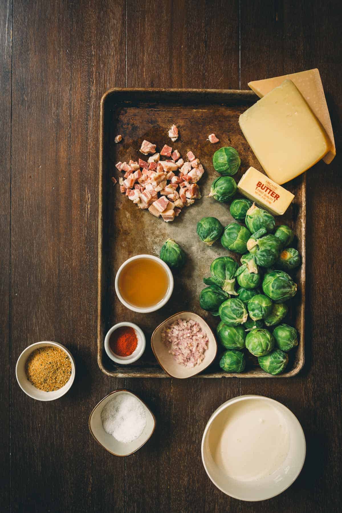 Ingredients for brussels sprouts on a tray.