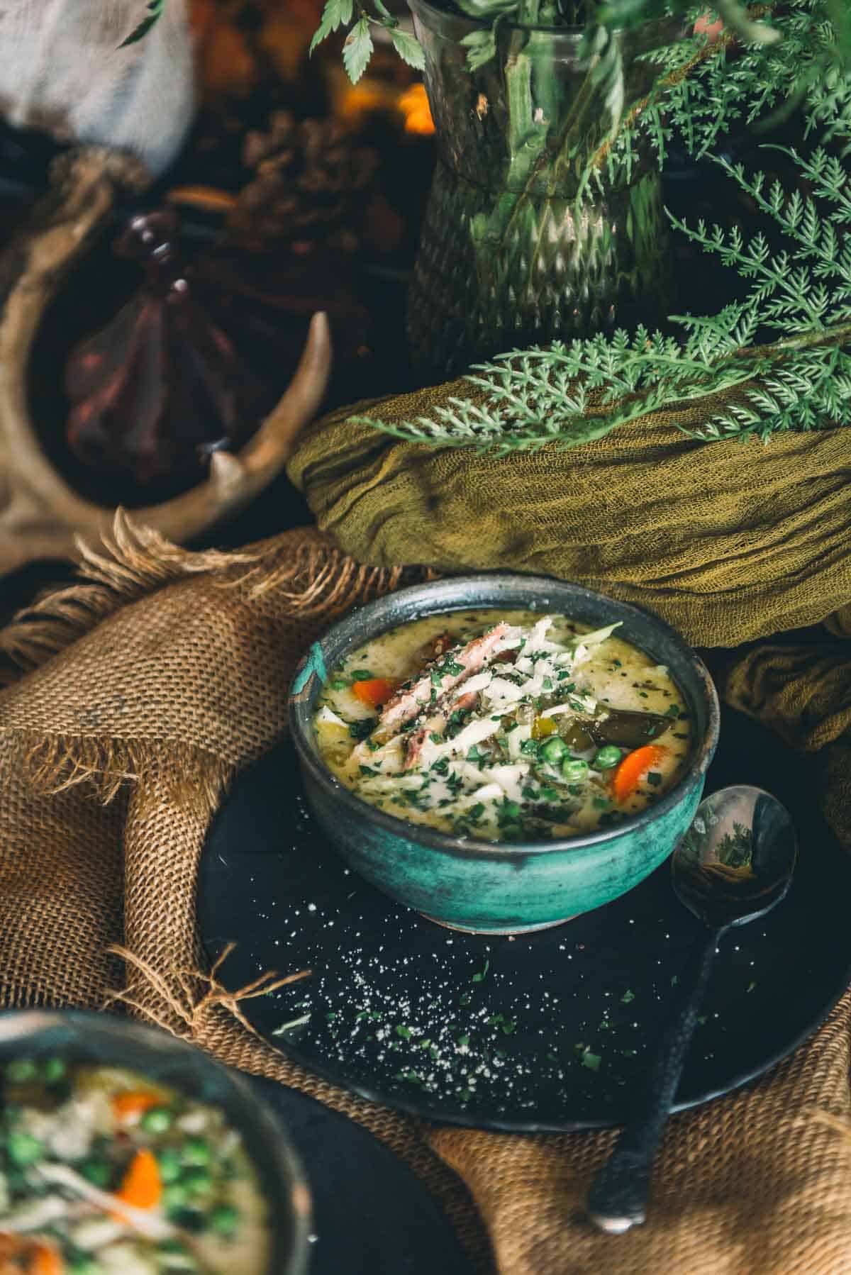 Two bowls of soup on a table.