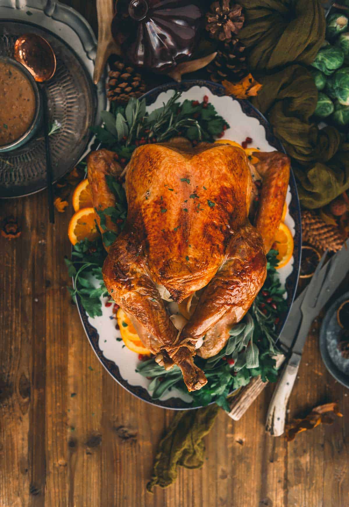 Oven roasted turkey on a serving platter. 