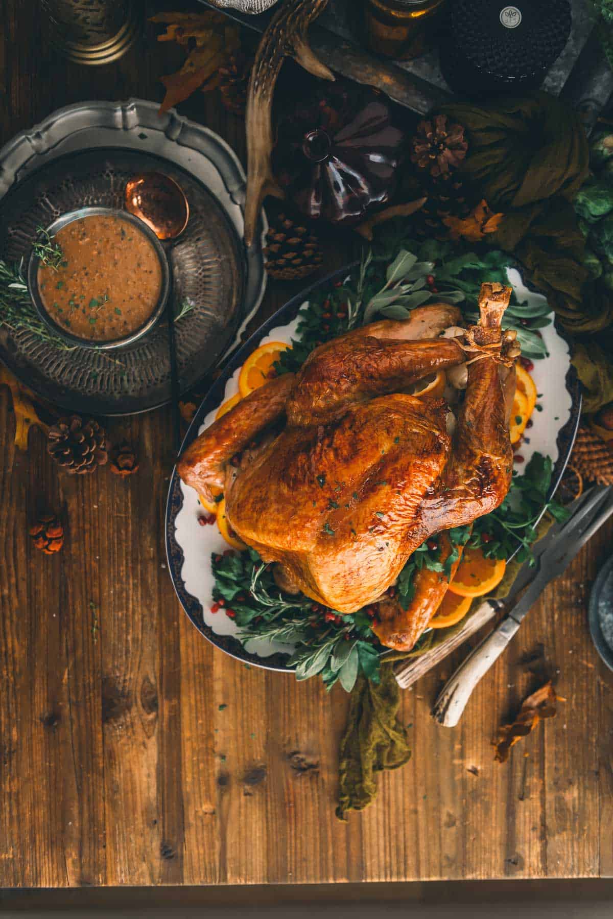 Oven roasted turkey on wood table.