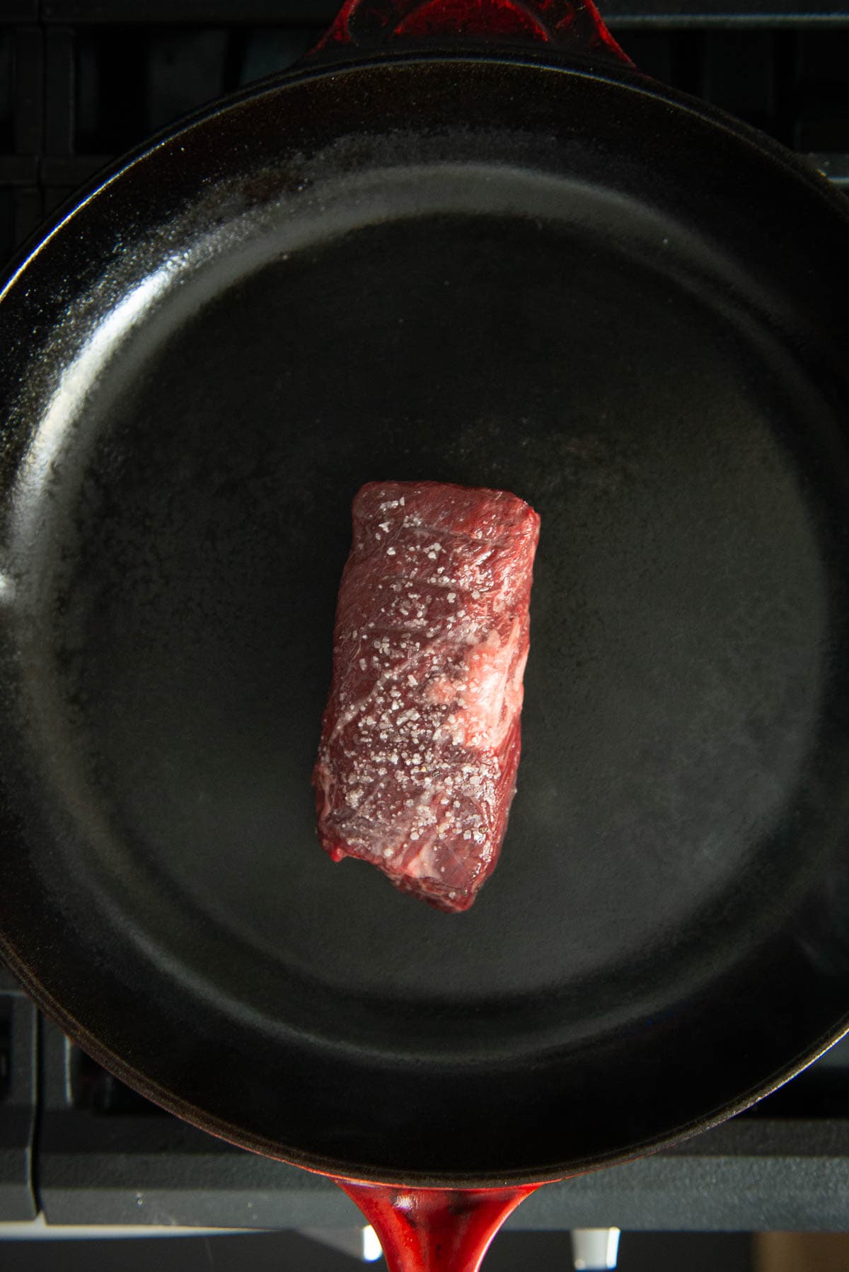 Hanger steak in a frying pan.