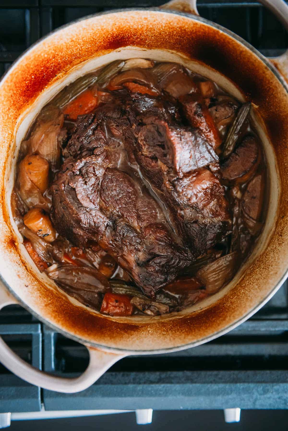 Pot roast in a dutch oven after several hours braising.