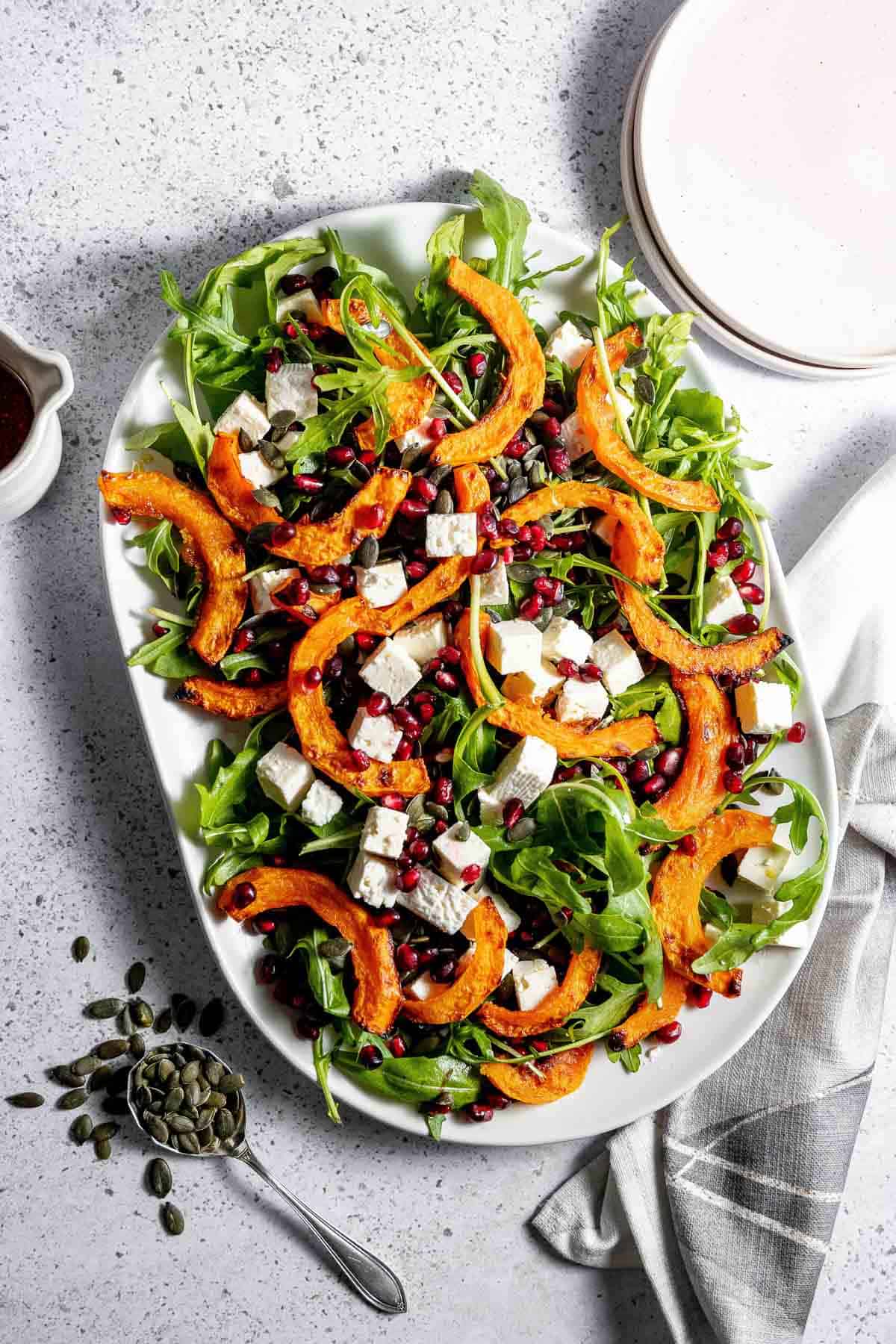 Roasted butternut squash salad with feta and pomegranate seeds.