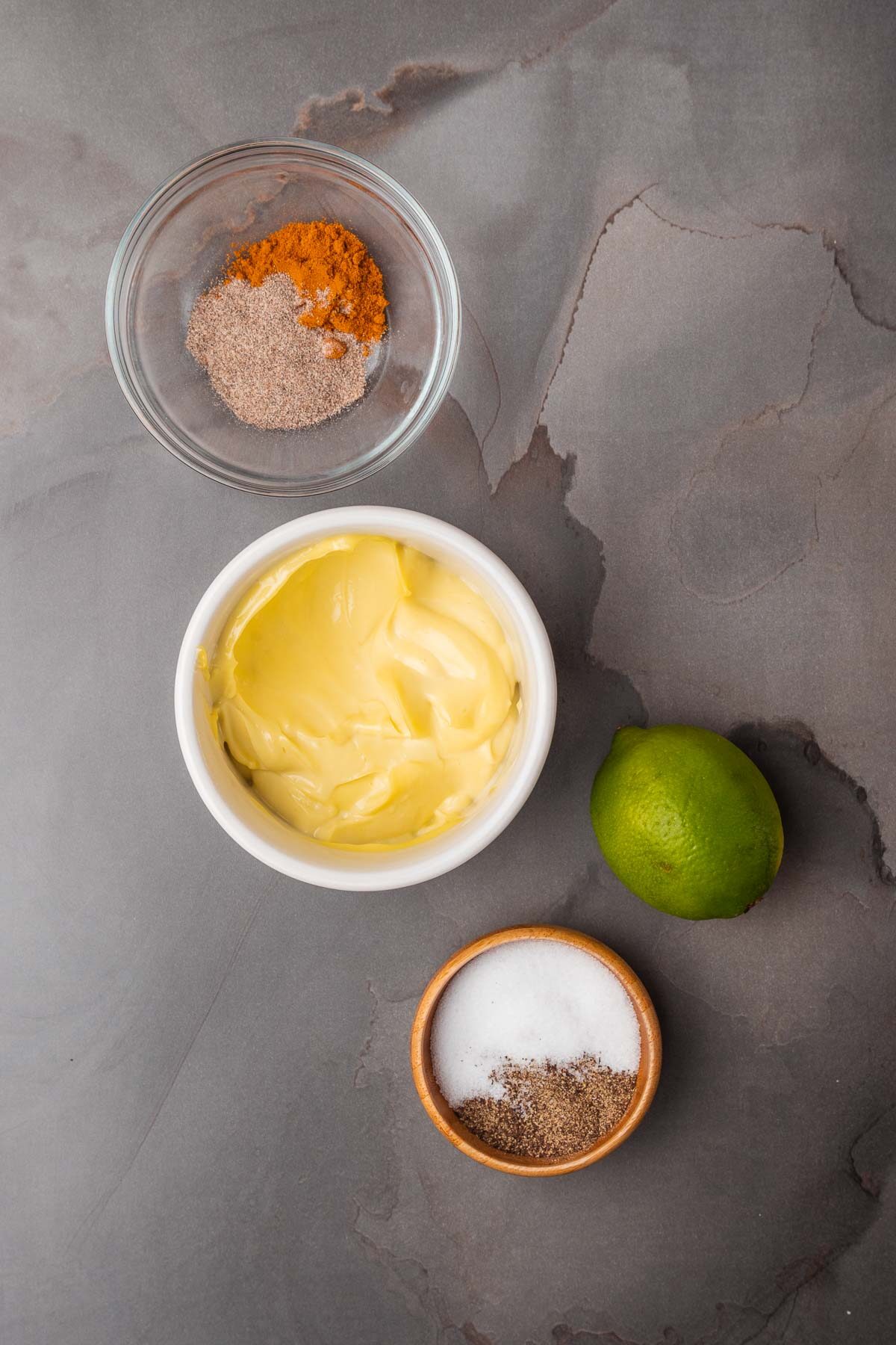 A bowl of ingredients for a homemade Turmeric aioli.