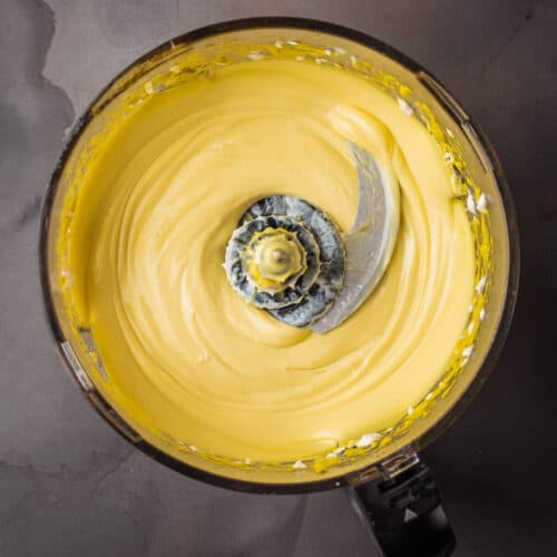 A yellow batter in a mixing bowl.