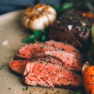 A denver steak and vegetable on a platter.