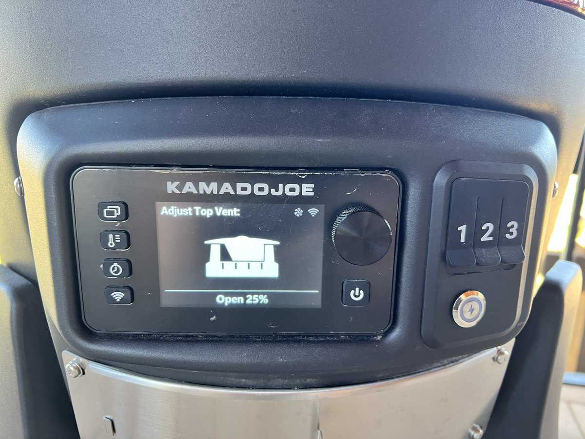 Close-up of a Kamado Joe grill display screen showing an adjustment for the top vent, currently open at 25%. Various control icons are visible on the left side of the screen.