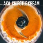 Top view of a blender containing an orange-colored chipotle crema mixture, with text as an image for Pinterest.