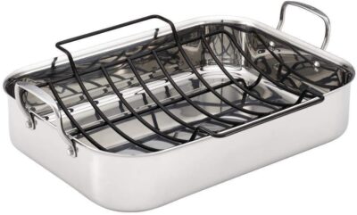A stainless steel roasting pan with a removable black rack and two handles, designed for cooking and roasting.