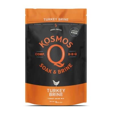 A 16 oz package of Kosmos Q Turkey Brine mix, featuring an orange and black design with text stating "Soak & Brine" and "Award Winning.