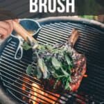 A hand applies a homemade herb basting brush to meat grilling on a BBQ. Text reads: "How to Make a Herb Basting Brush." A website link is provided at the bottom.