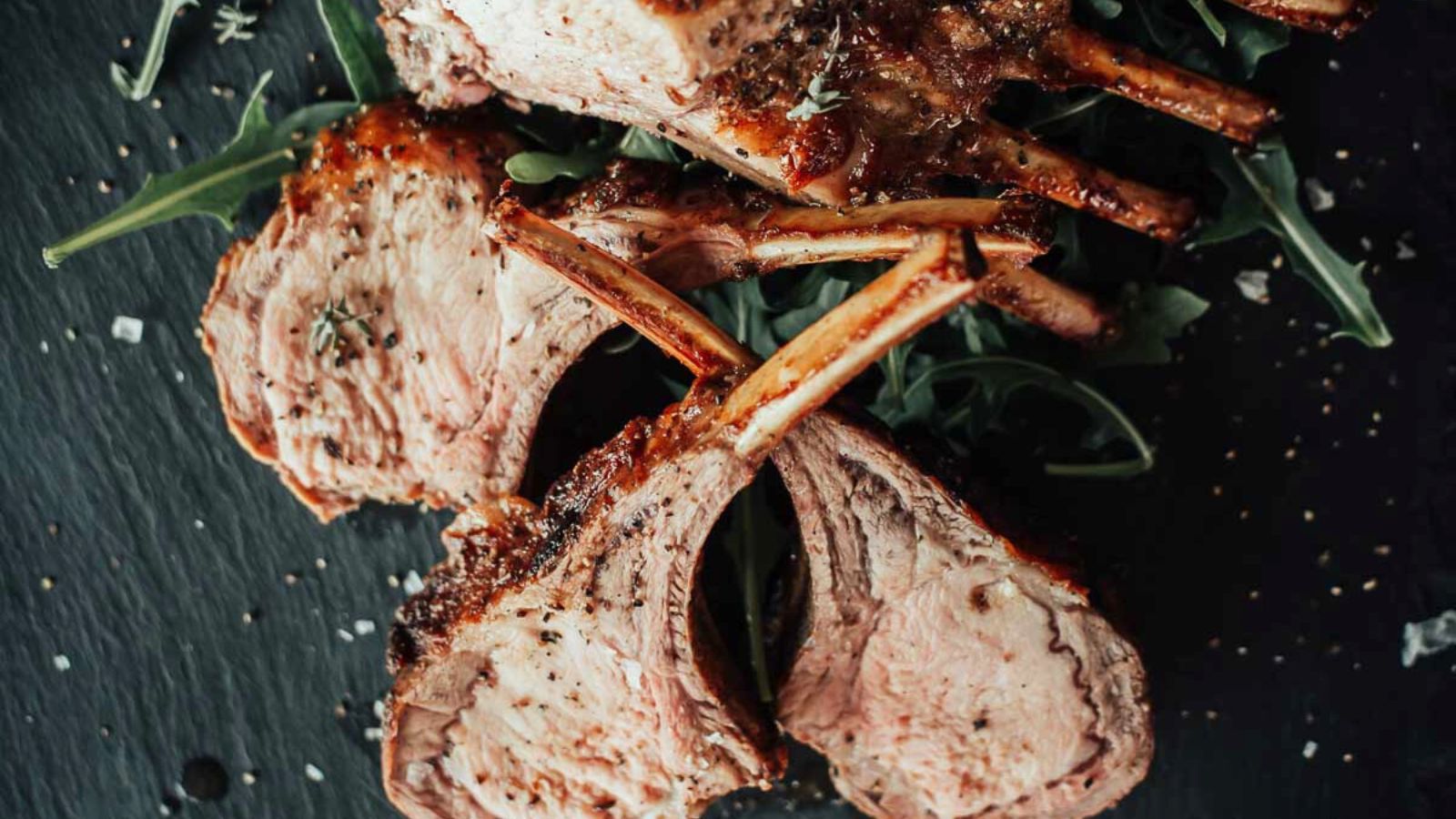 Oven-roasted rack of boar with a golden crust and juicy center.