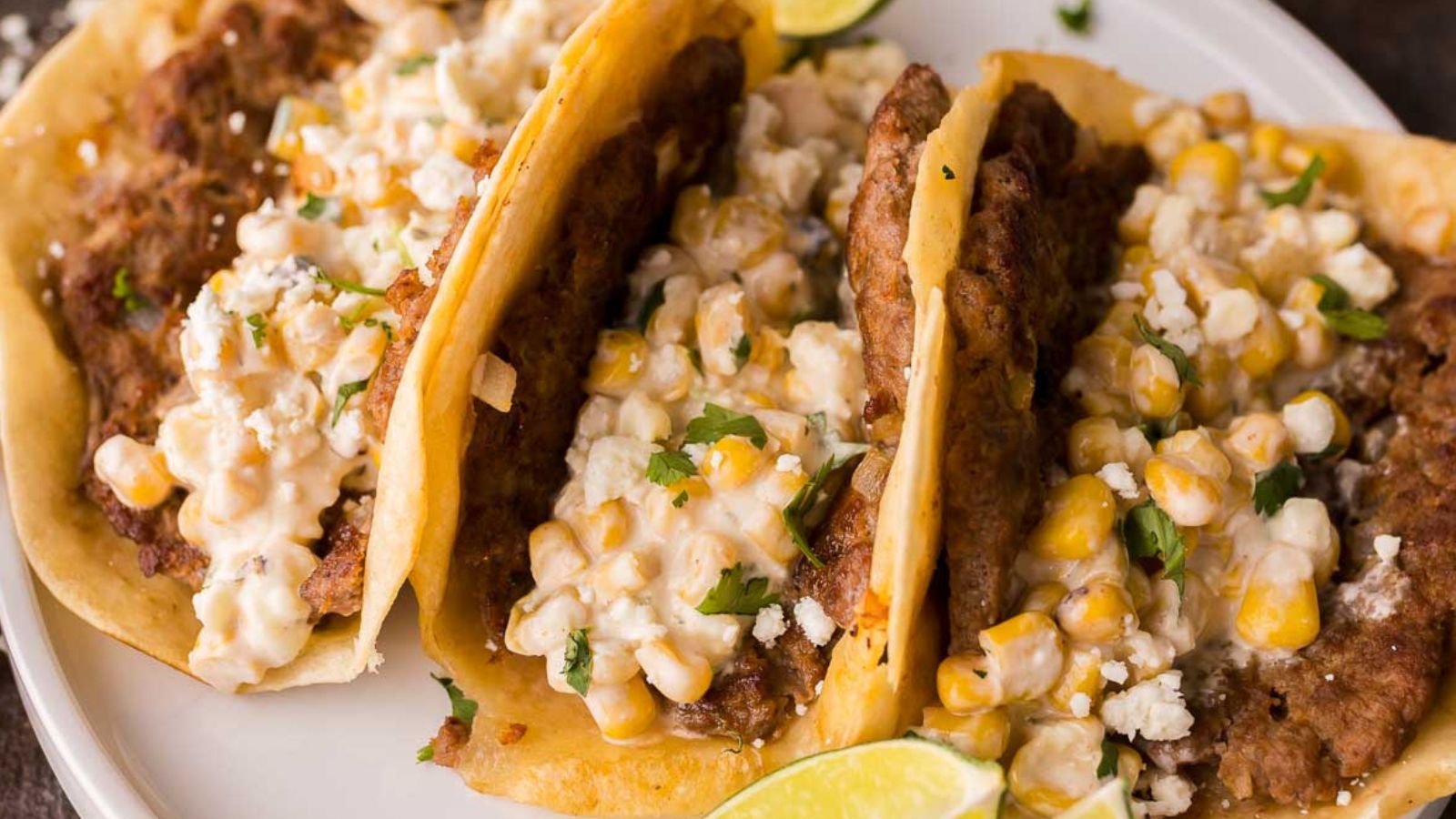 Mexican street corn smash tacos with charred corn and creamy toppings.