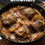 A skillet filled with cooked chicken thighs, apple slices, and herbs, with text reading "How to Make Apple Cider Chicken.