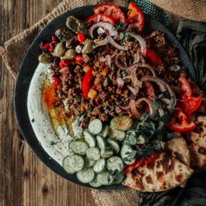 Mediterranean lamb recipe with tomatoes, cucumber, and olives