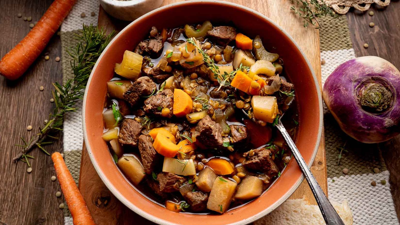Slow cooker beef stew with lentils, turnips, and carrots simmered thick.