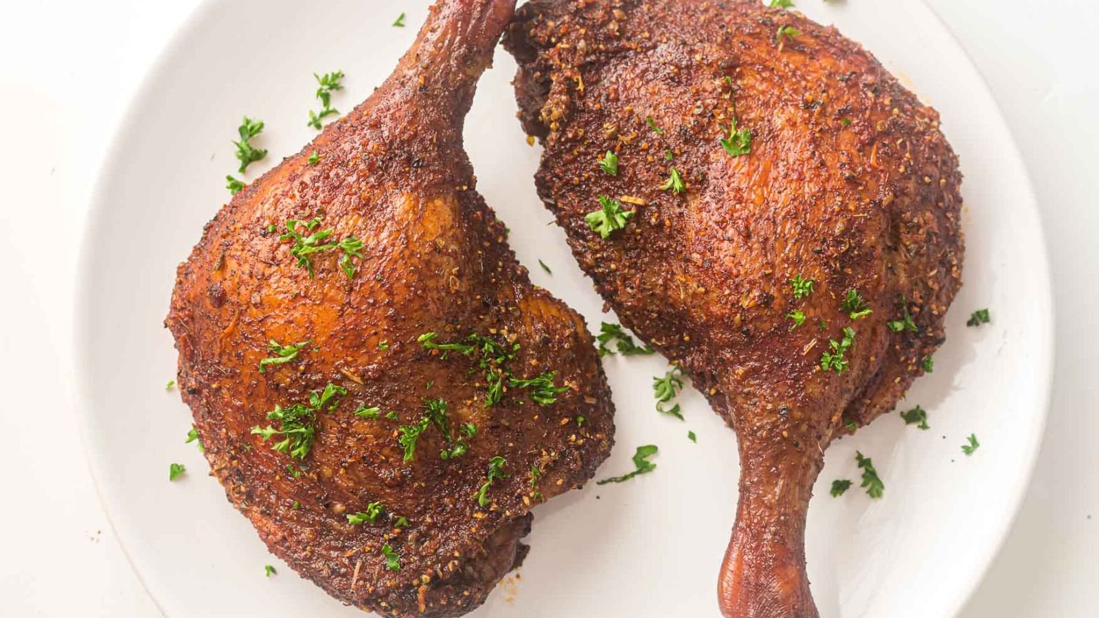 Smoked duck legs cooked low and slow until the skin is crisp and the meat pulls easily from the bone.