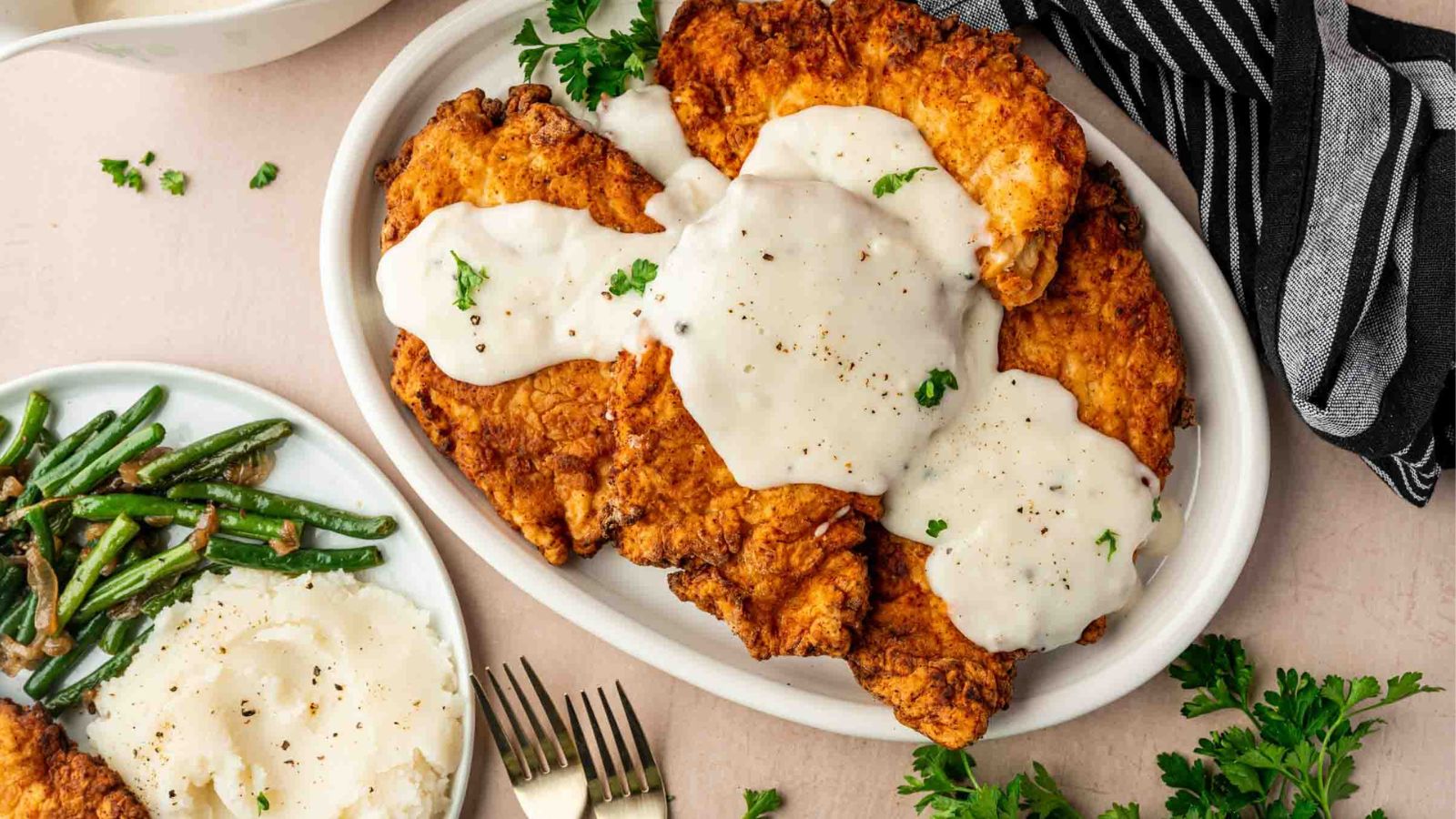 Crispy chicken-fried chicken topped with creamy white gravy.