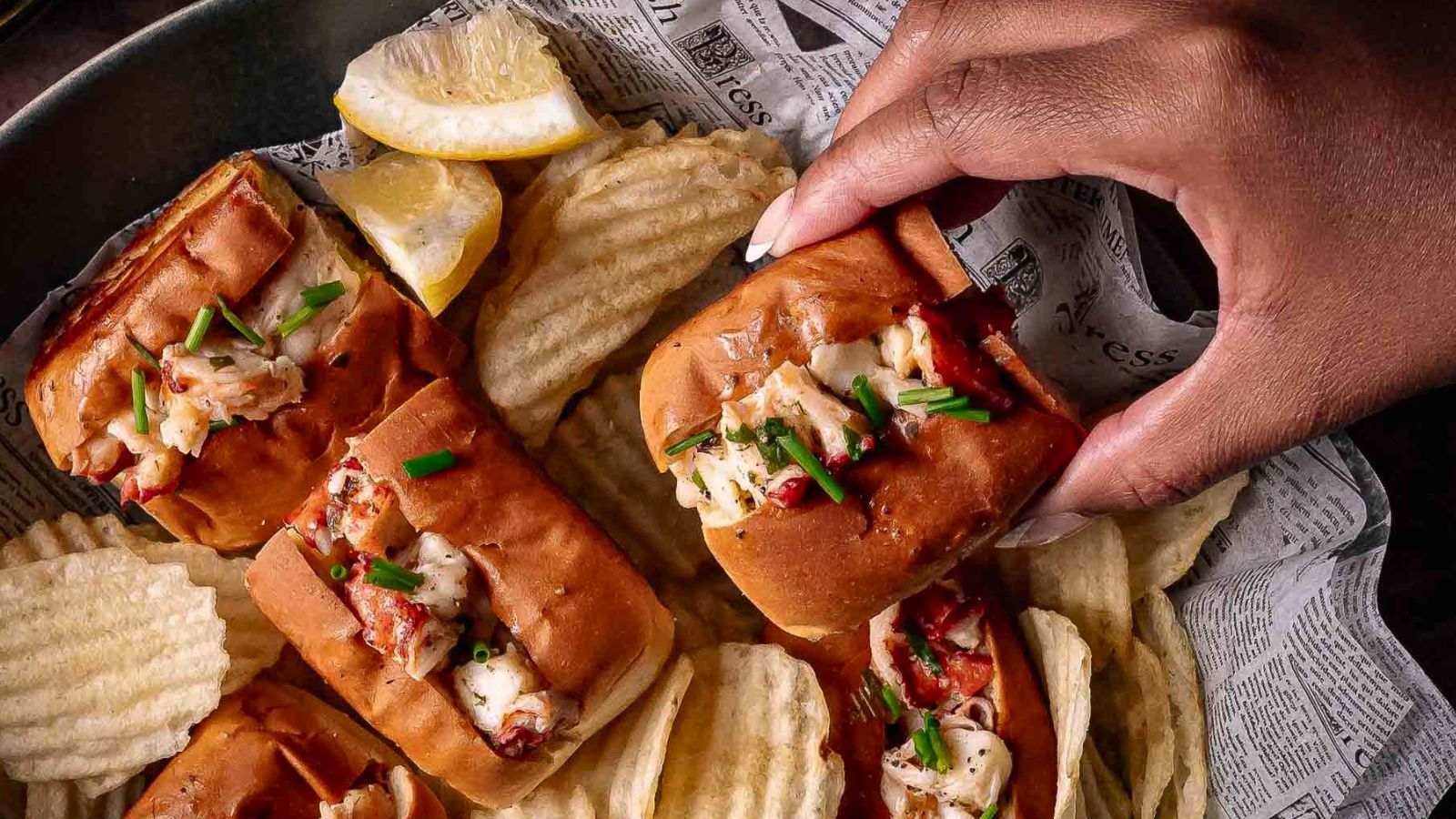 Mini lobster rolls filled with warm tarragon butter lobster.