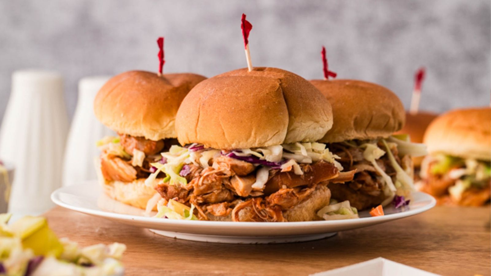 BBQ chicken cooked in a slow cooker until tender and piled onto soft rolls.