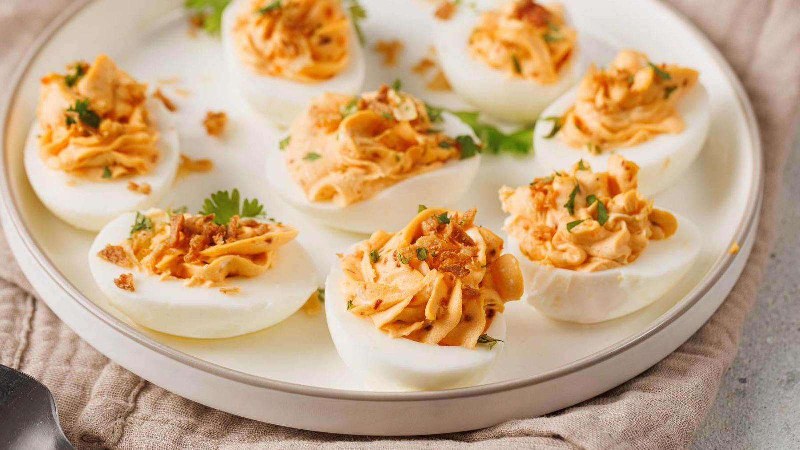 Spicy deviled eggs with a creamy filling and a sharp kick of heat.