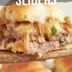 Close-up of French dip sliders with shredded beef, melted cheese, caramelized onions, and fresh herbs on soft buns. Text overlay explains how to make them and directs to a recipe website.