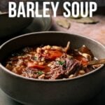 A bowl of slow cooker beef and barley soup sits on a table, topped with herbs; text above reads "How to Make Slow Cooker Beef and Barley Soup.
