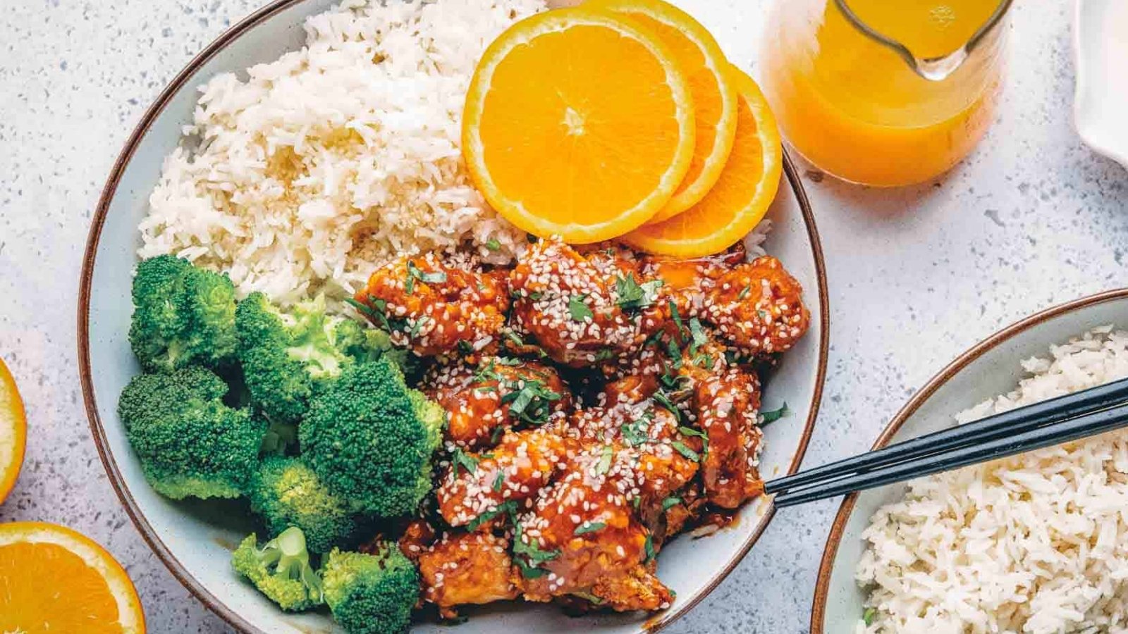 Air fryer orange chicken coated in a sweet, lightly spicy glaze.