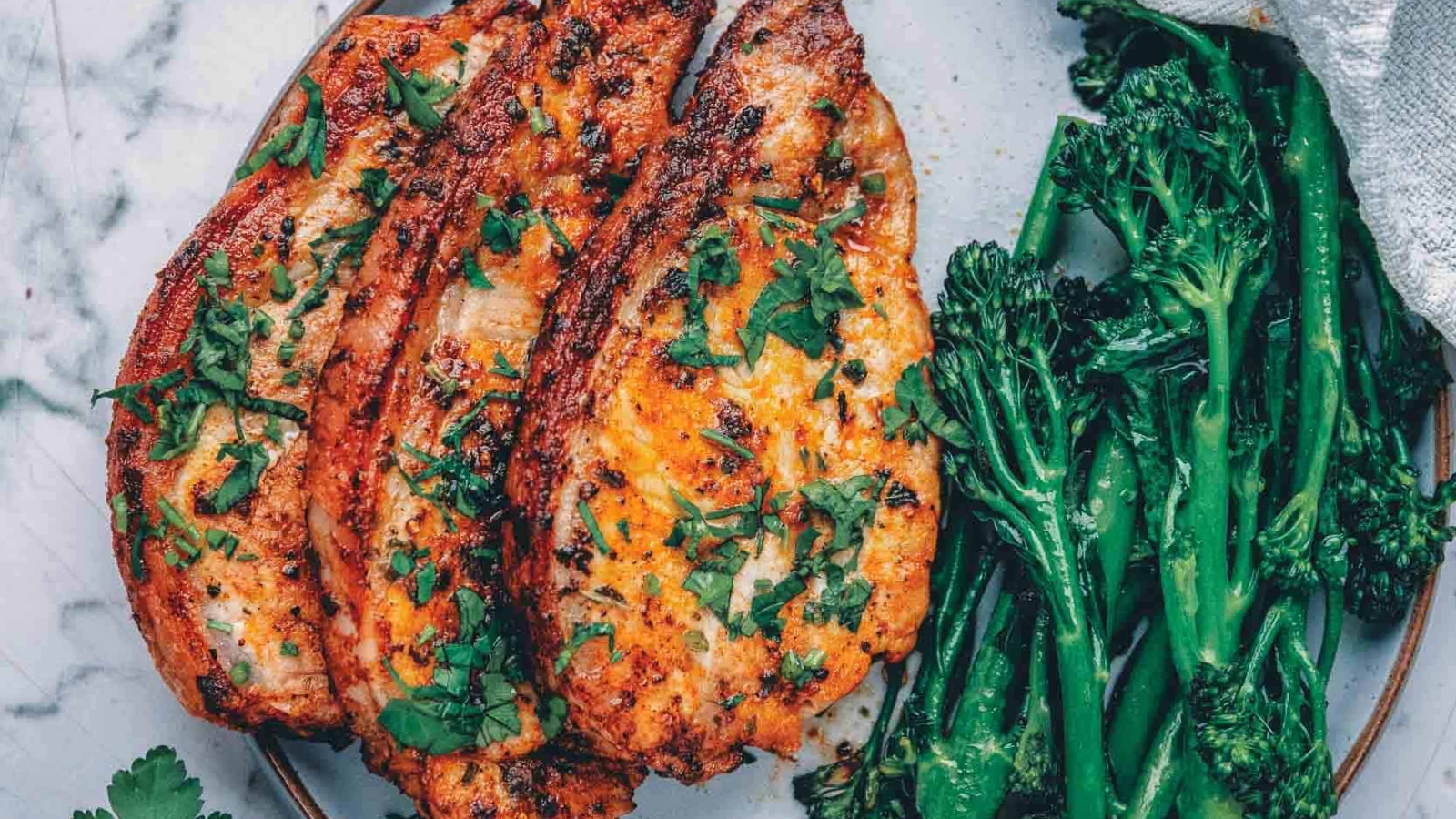 Air fryer pork chops cooked until juicy with a lightly crisp exterior.