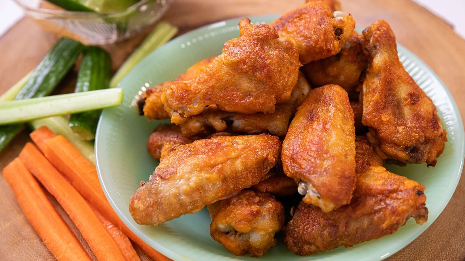 Baked buffalo chicken wings with crisp skin and spicy sauce.