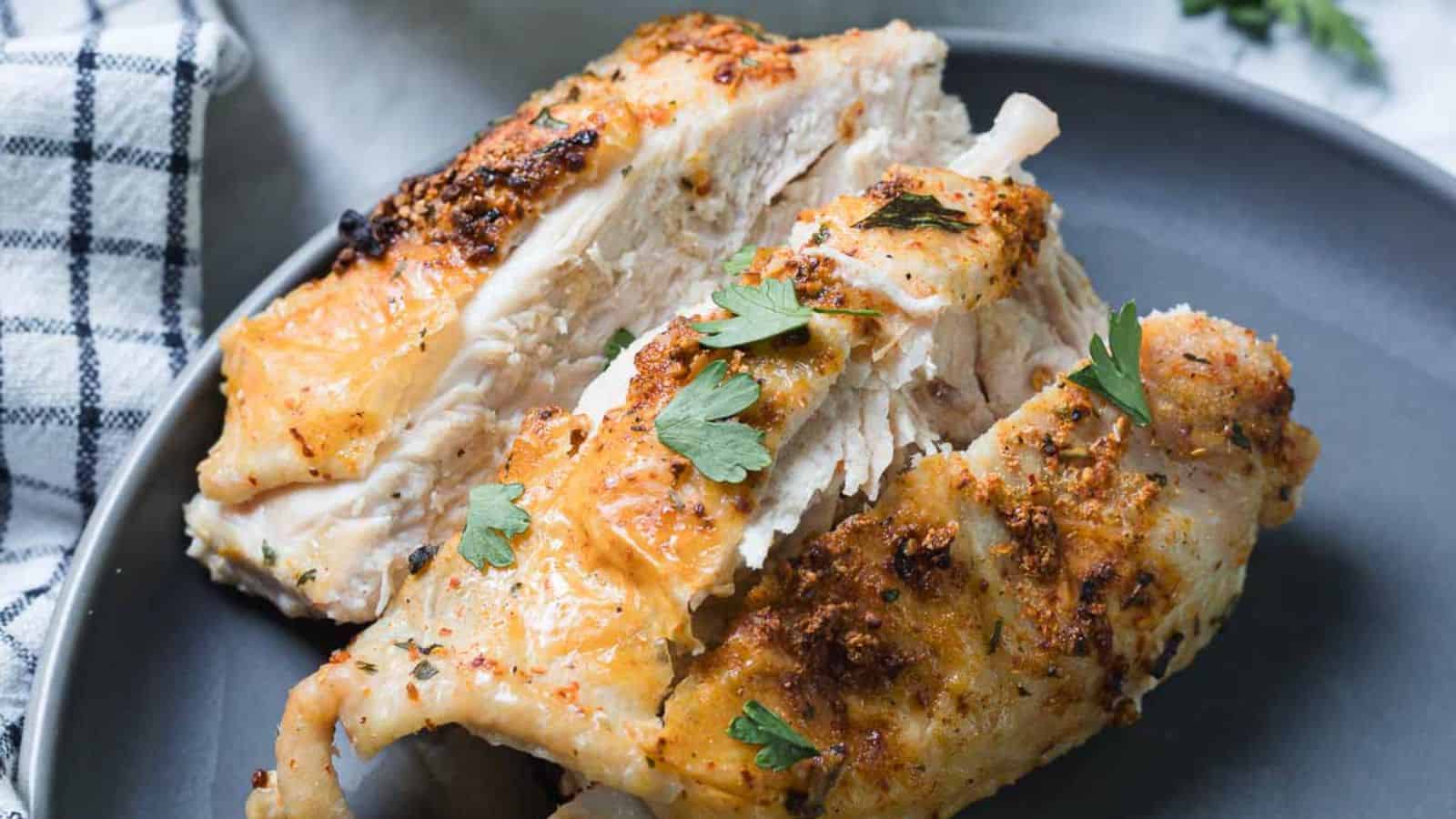 Cajun baked turkey breast roasted with vegetables until tender and lightly browned.