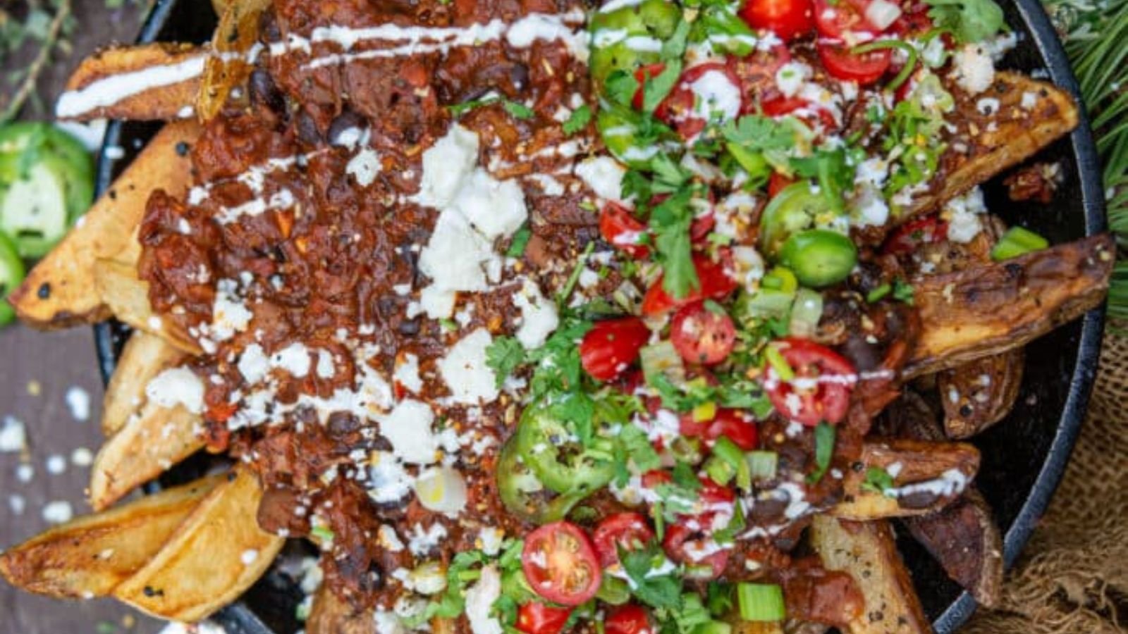 French fries cooked in cast iron topped with chili.