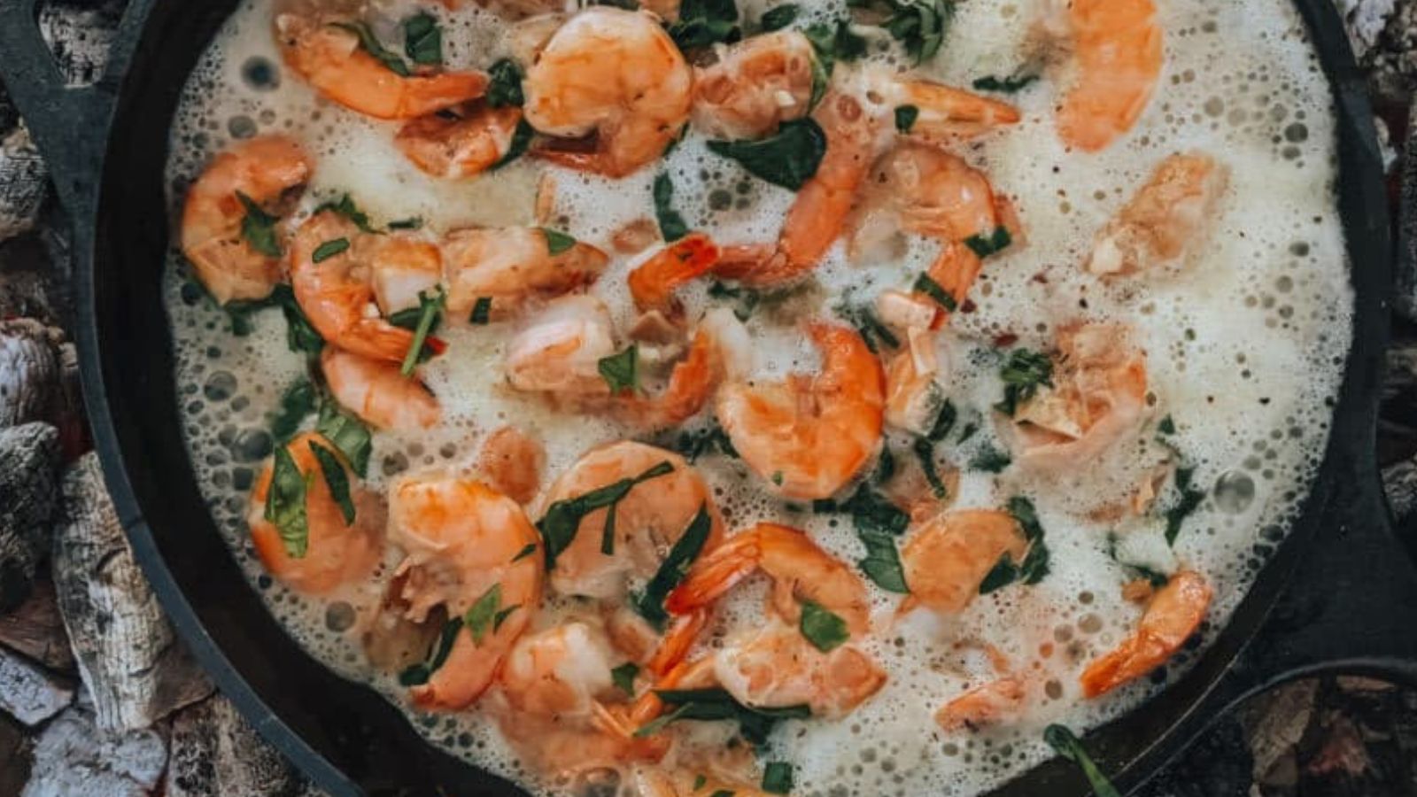 Garlic butter shrimp cooked quickly in a skillet with browned edges.