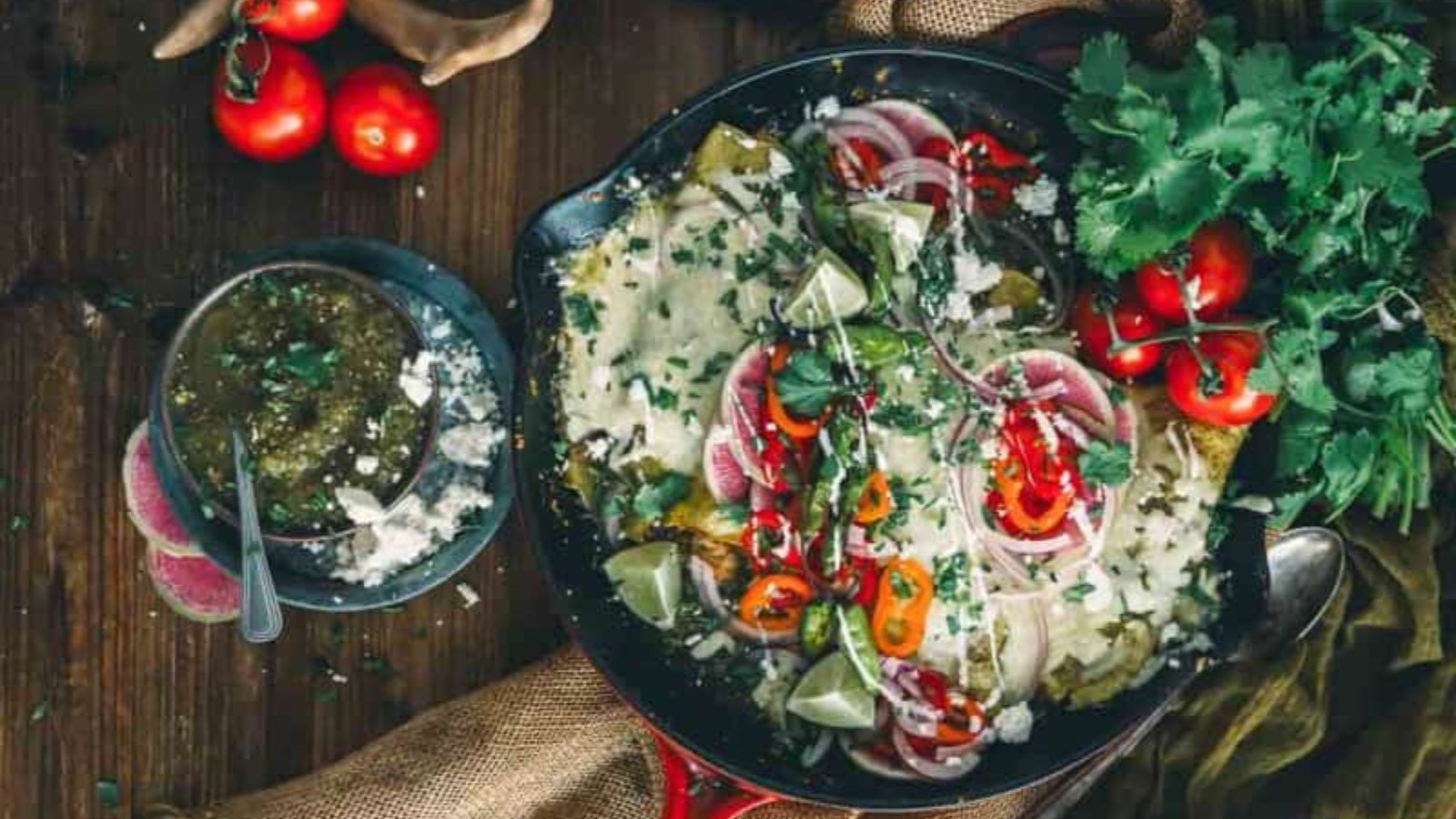 Turkey enchiladas verdes baked with sauce and melted cheese.