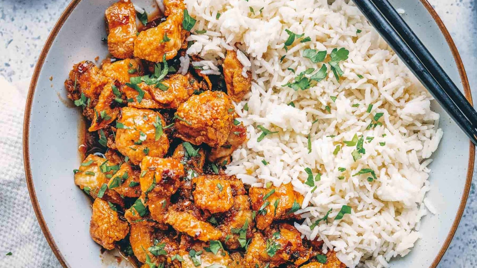 Air fryer honey garlic chicken bites cooked crisp and coated in sticky sauce.