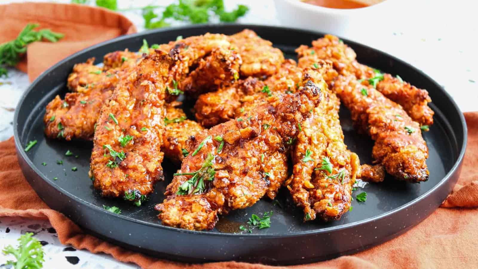 Air fryer hot honey chicken tenders with a sticky, spicy glaze.