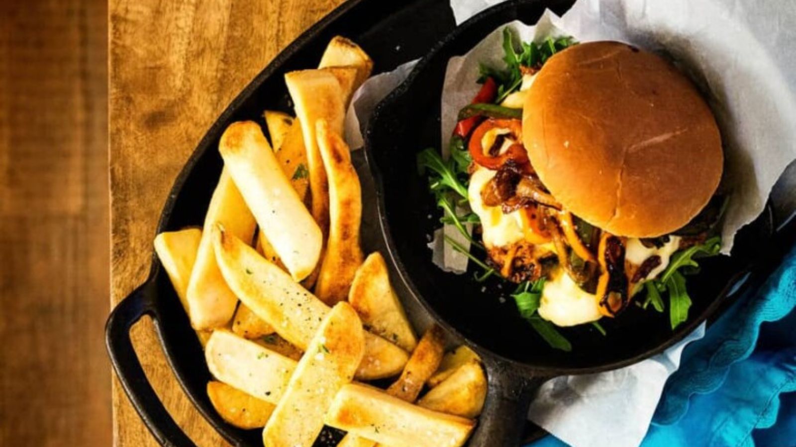 Pulled chicken Philly sliders loaded into soft rolls with melty toppings.