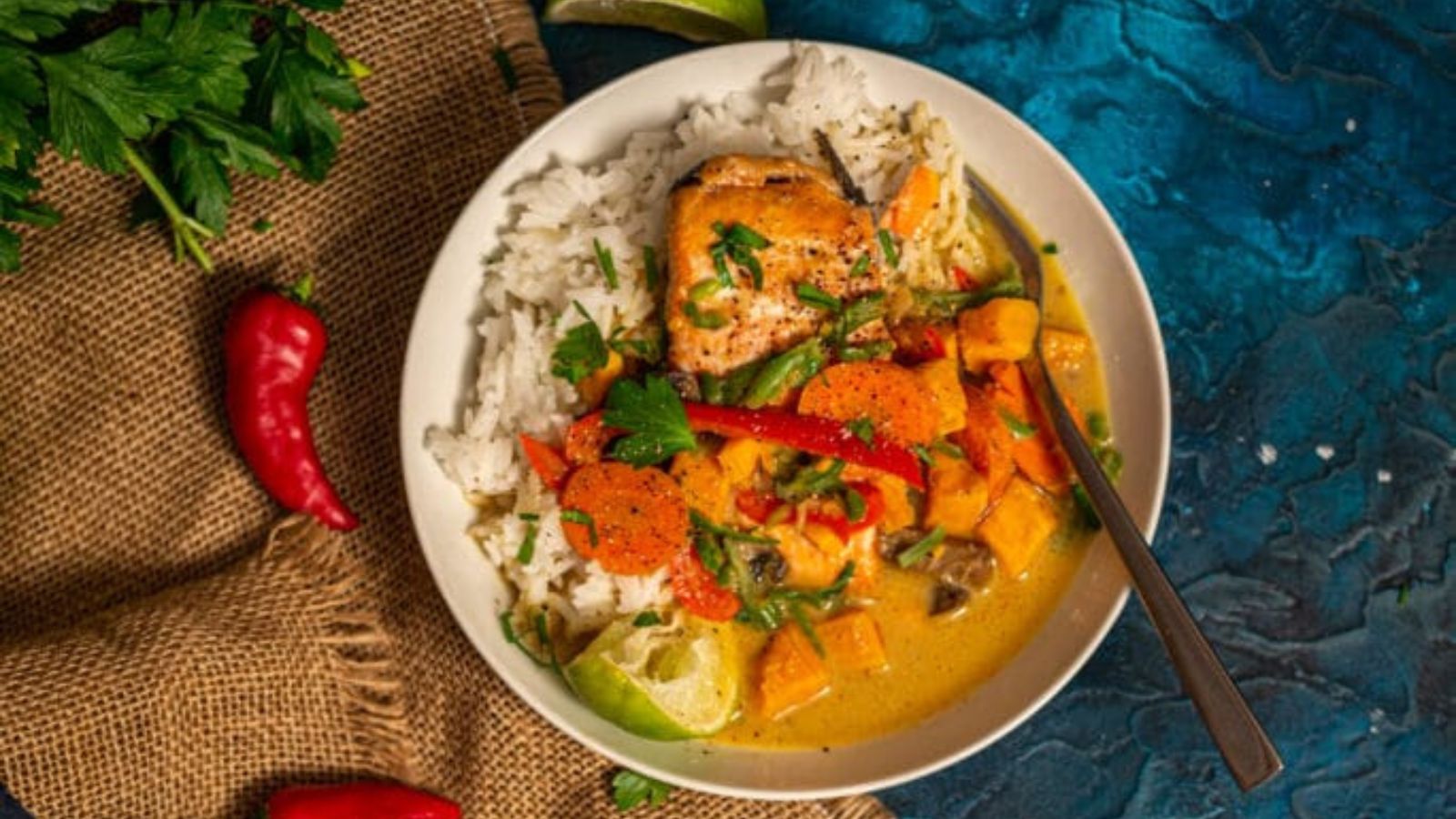 Salmon curry simmering with coconut milk and spices served vibrant and aromatic.