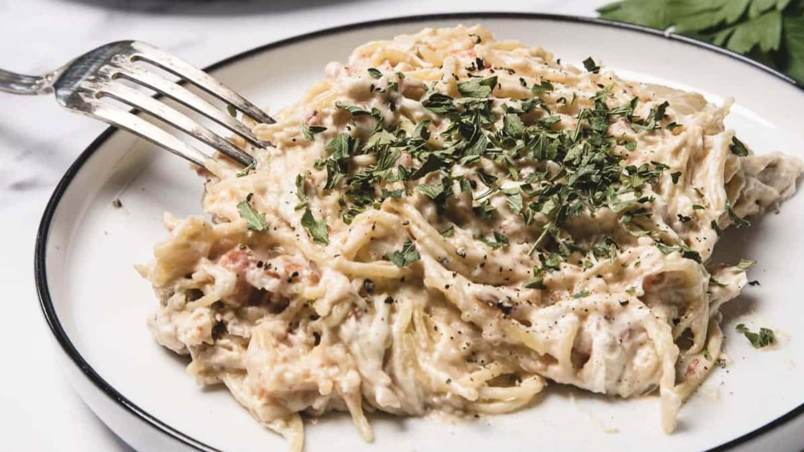 Chicken spaghetti slow cooked with pasta and creamy sauce.