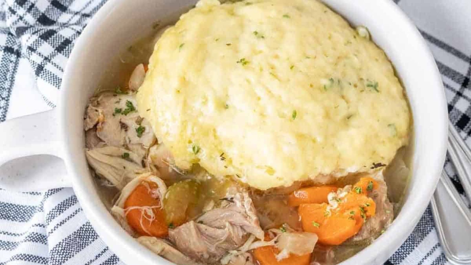 Chicken and dumplings slow cooked with soft dumplings on top.