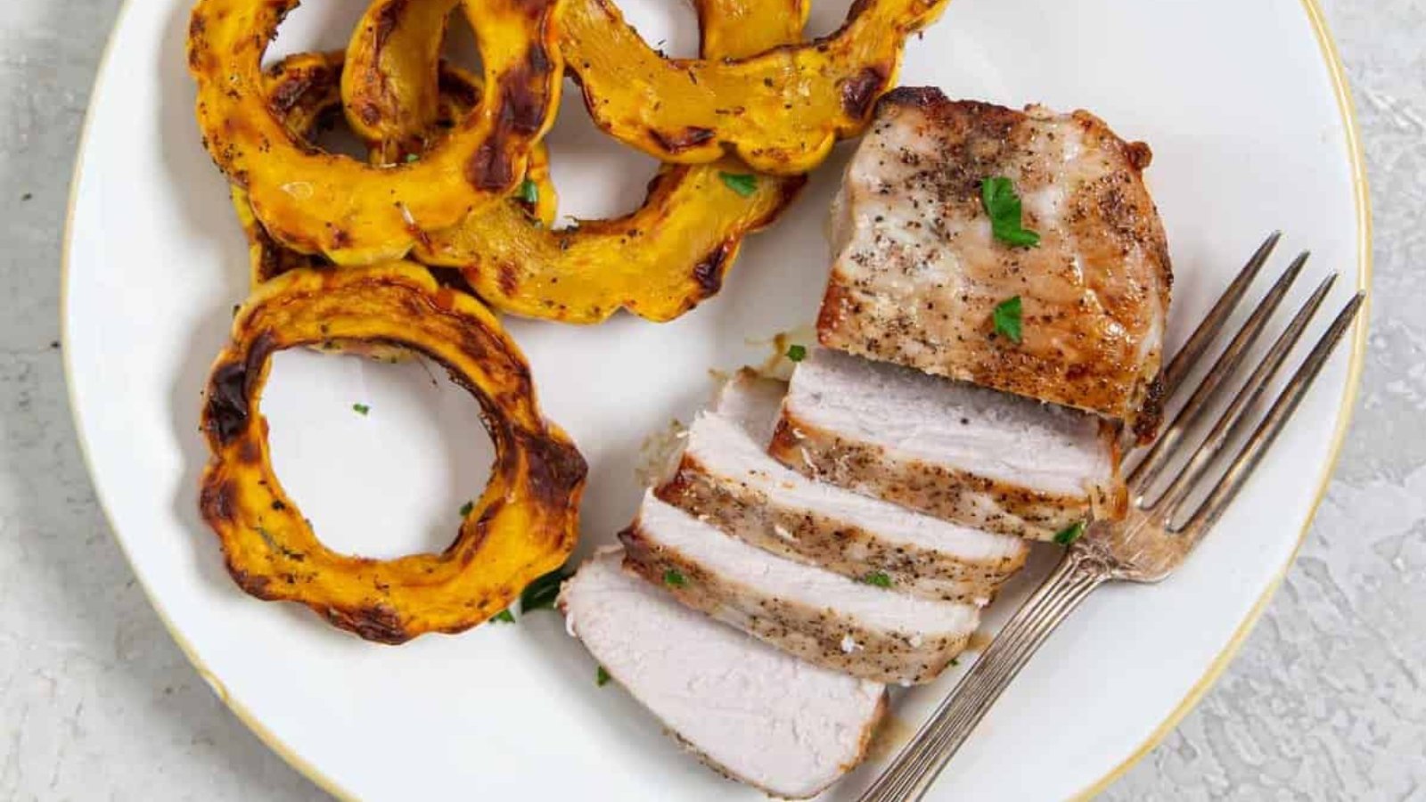 Air fryer thick pork chops cooked evenly with a juicy interior.