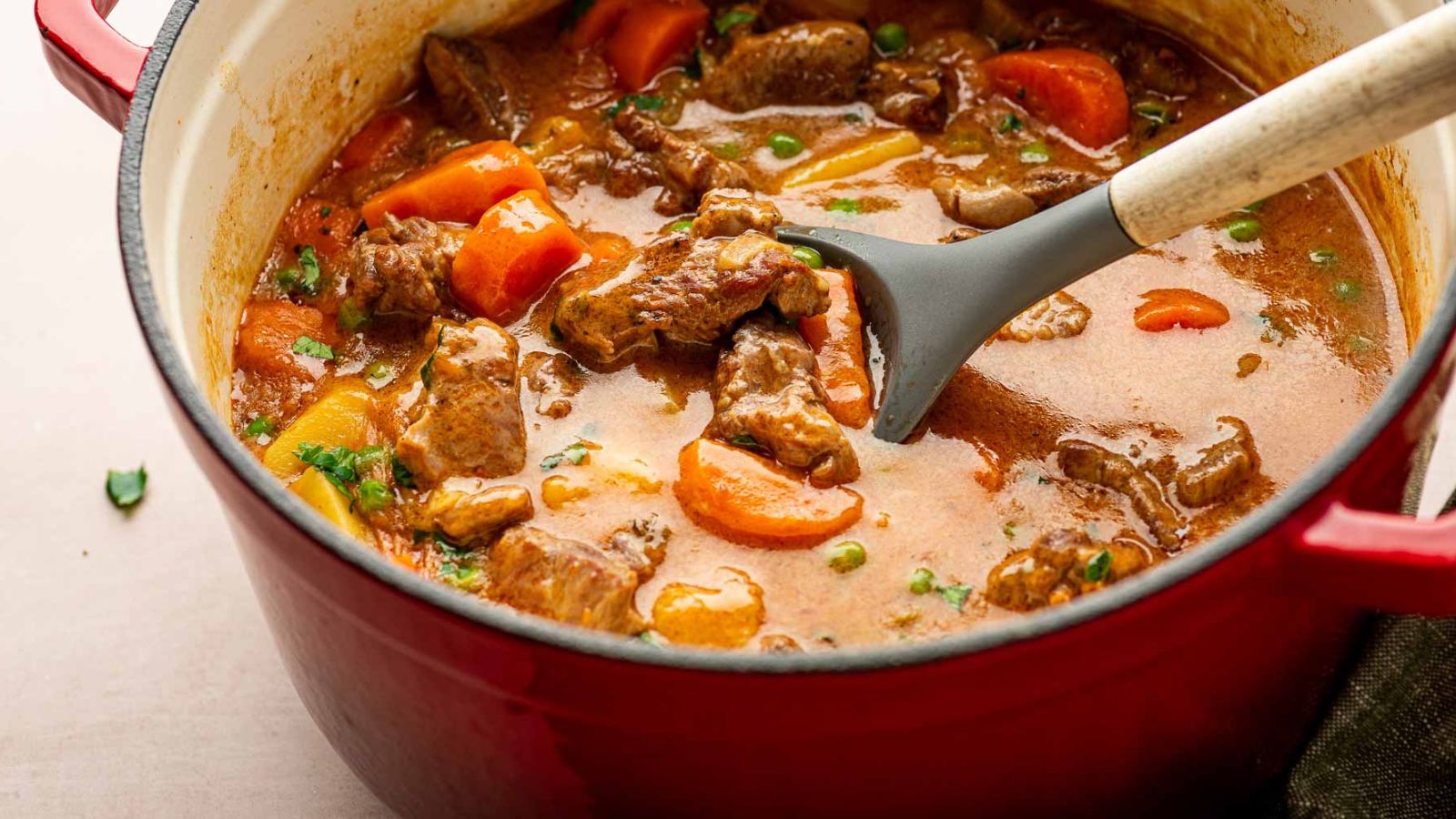 Dutch Oven Lamb Stew: Lamb stew slow-cooked in a Dutch oven with vegetables in a rich broth.