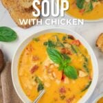 A bowl of Tuscan white bean soup with chicken, garnished with basil, served with toasted bread slices on the side. Text overlay shares recipe information.