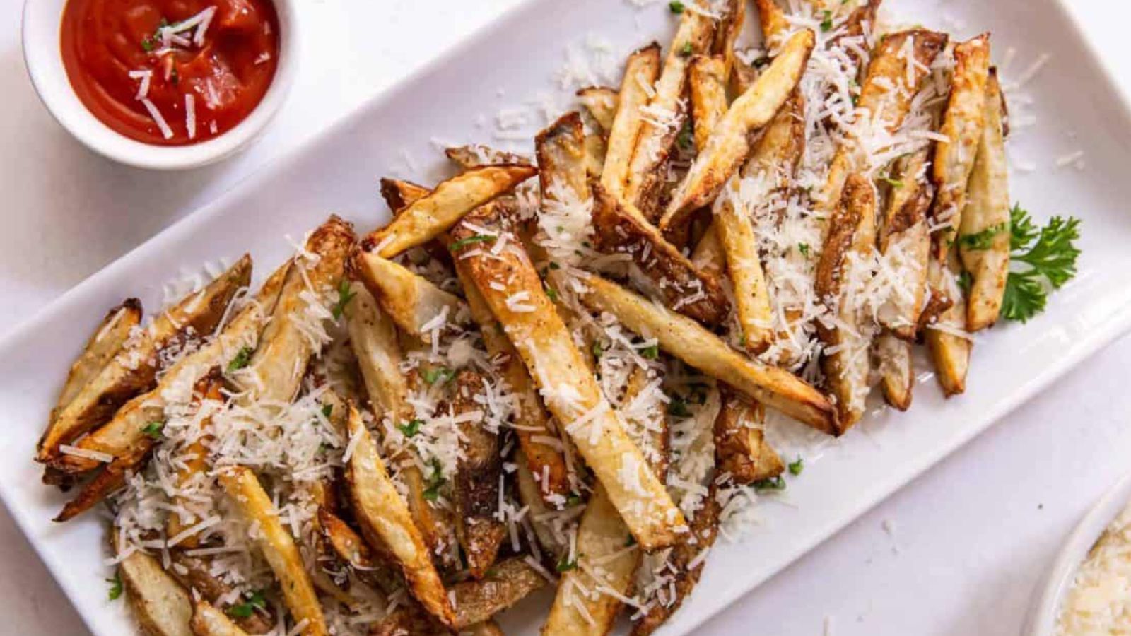 Air fryer garlic parmesan fries crisped golden and coated with cheese and garlic.